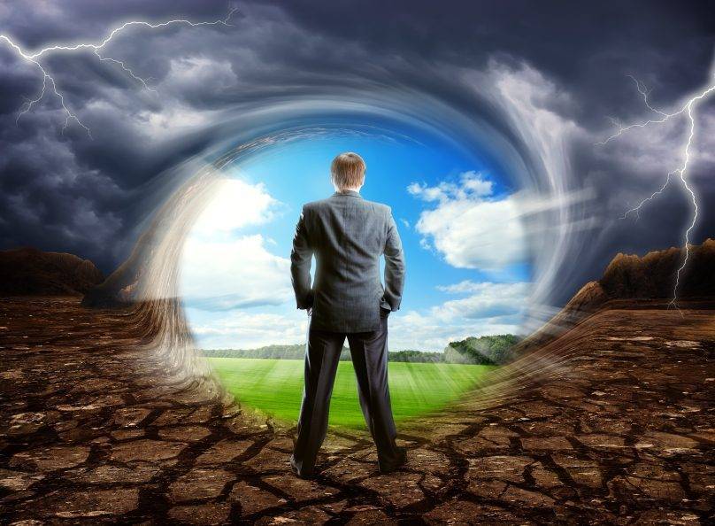 Businessman staying against cloudy clear sky, concept picture